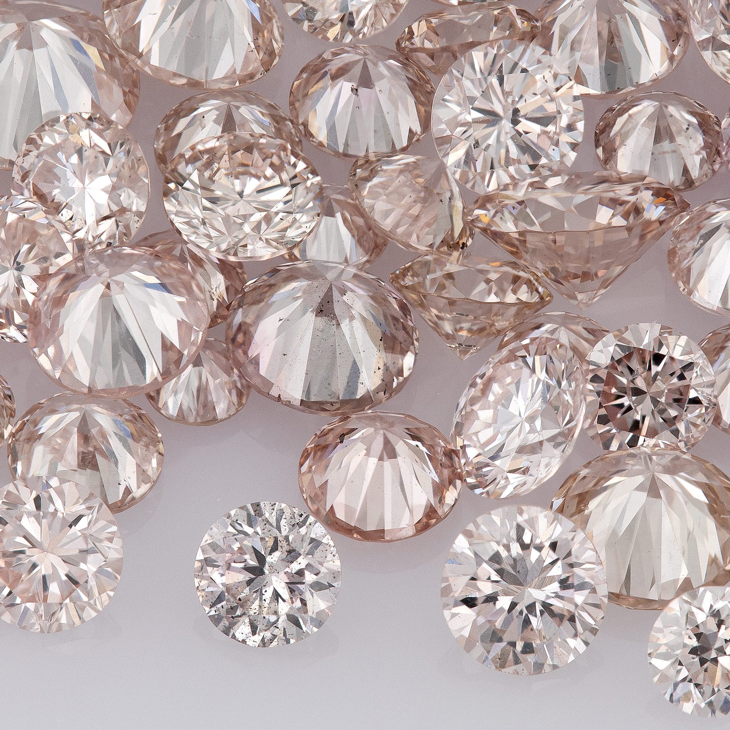 Fancy Light Pink Rose (9-8PR) | Argyle Pink Rosé Diamonds | Pink Untreated Natural Diamonds | Round | Melee | Accents | Cape Yellow