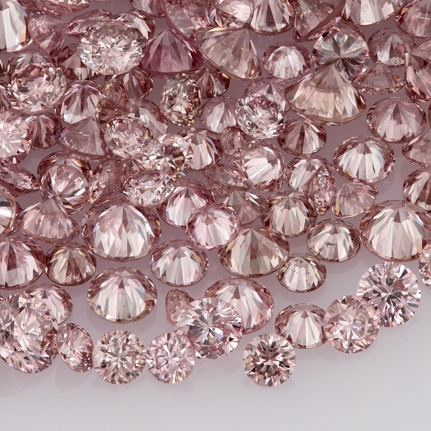 Fancy Vivid Pink Rose (6/5PR) | Argyle Pink Diamonds Select | Untreated Natural Pink Diamonds | Round Melee Accents