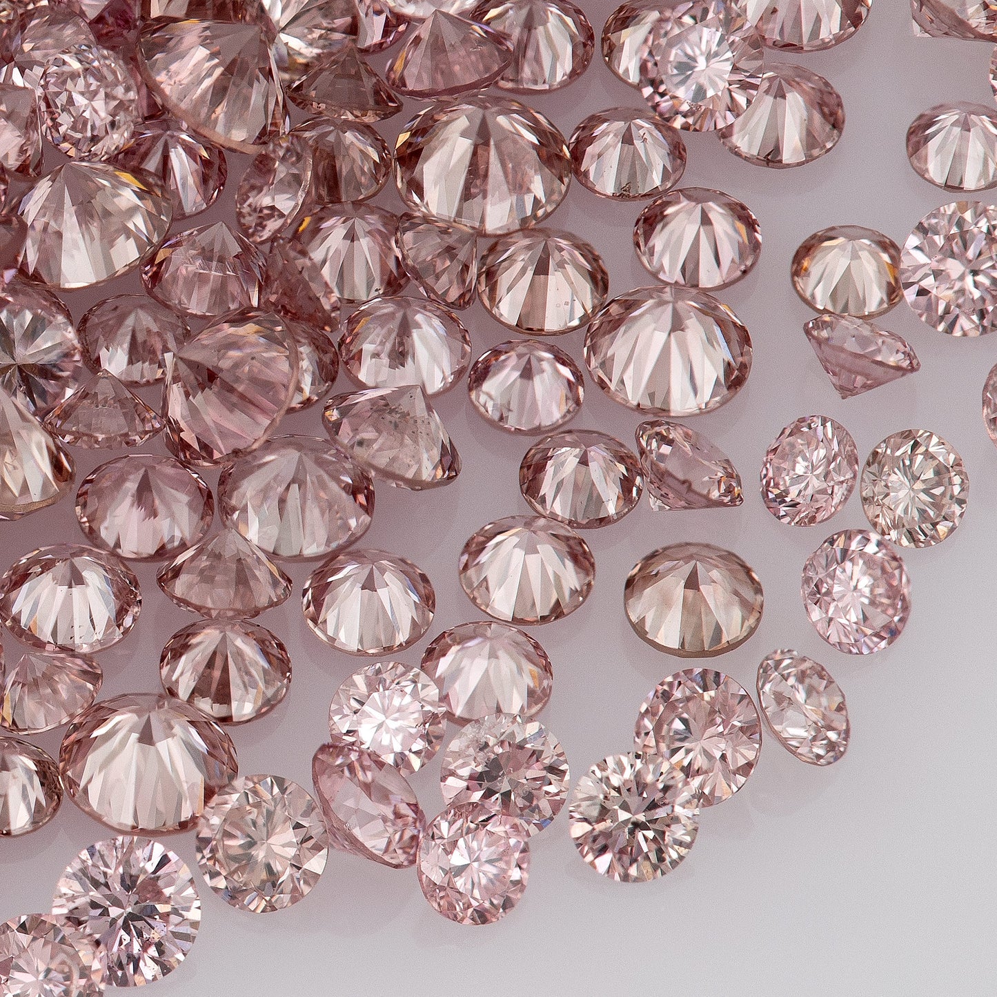 Fancy Vivid Pink Rose (6/5PR) | Argyle Pink Diamonds Select | Untreated Natural Pink Diamonds | Round Melee Accents