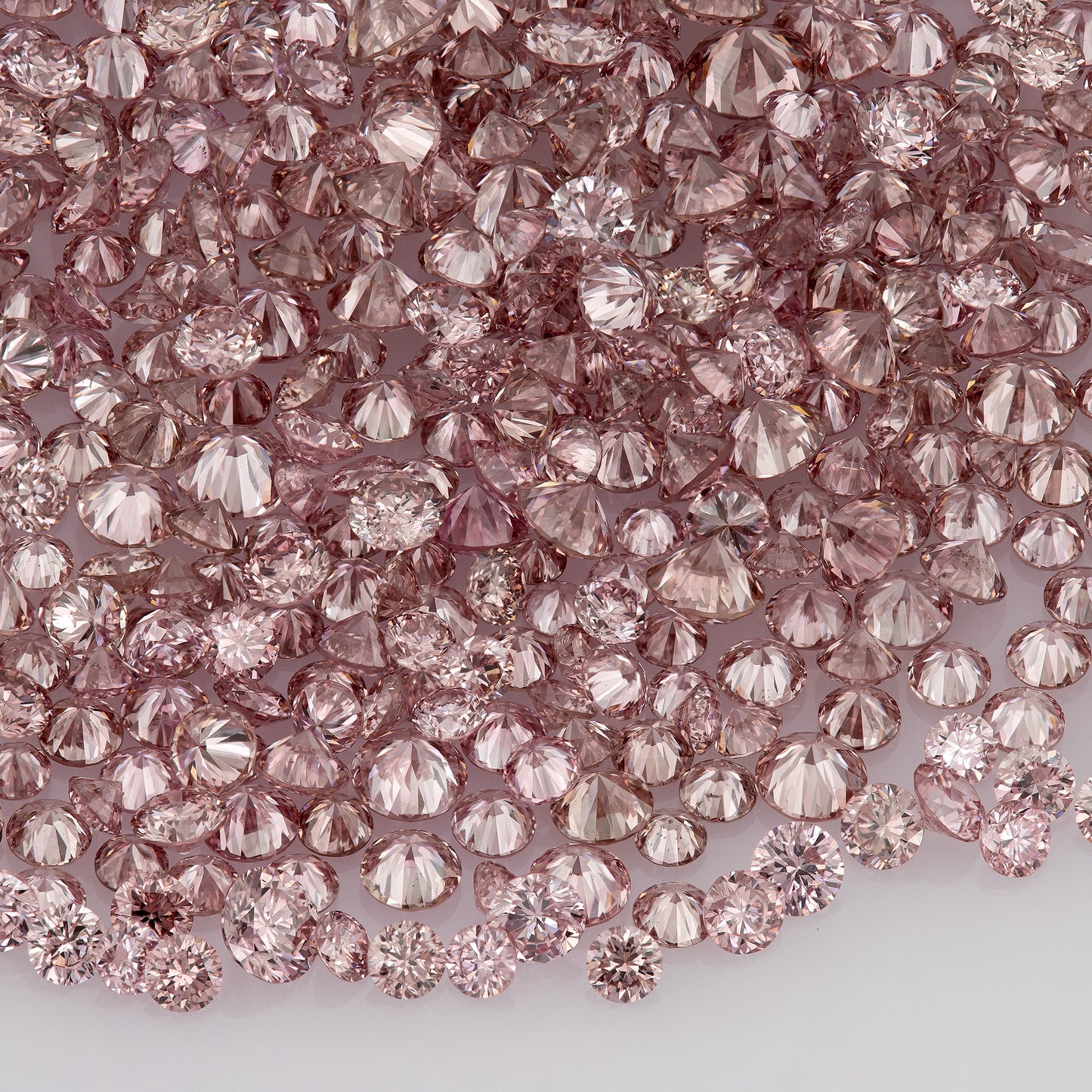 Fancy Vivid Pink Rose (6/5PR) | Argyle Pink Diamonds Select | Untreated Natural Pink Diamonds | Round Melee Accents