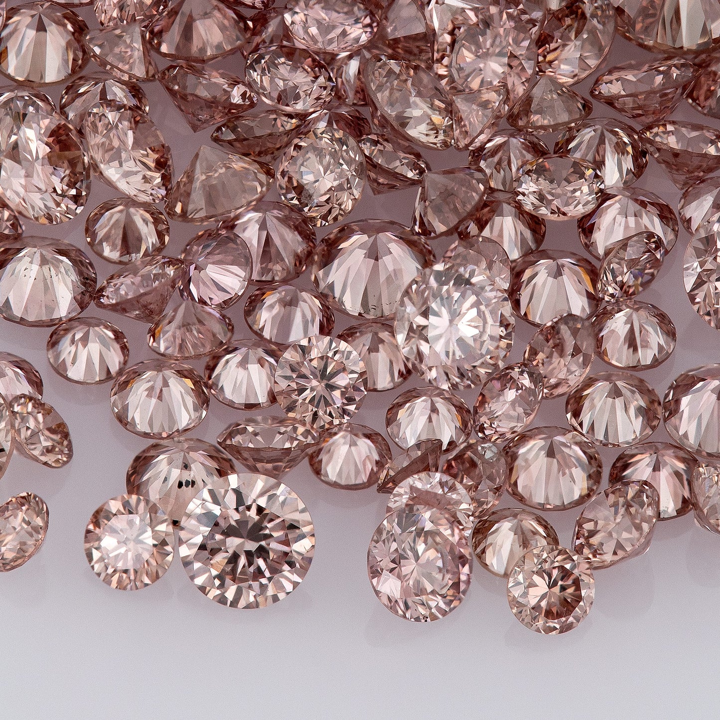 Fancy Vivid Pink Champagne PC2 | Argyle Pink Diamonds Select | Untreated Natural Pink Diamond | Round Melee Accents