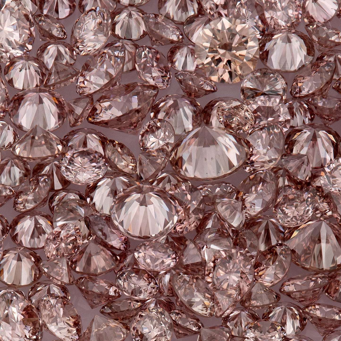 Fancy Vivid Pink Champagne PC2 | Argyle Pink Diamonds Select | Untreated Natural Pink Diamond | Round Melee Accents