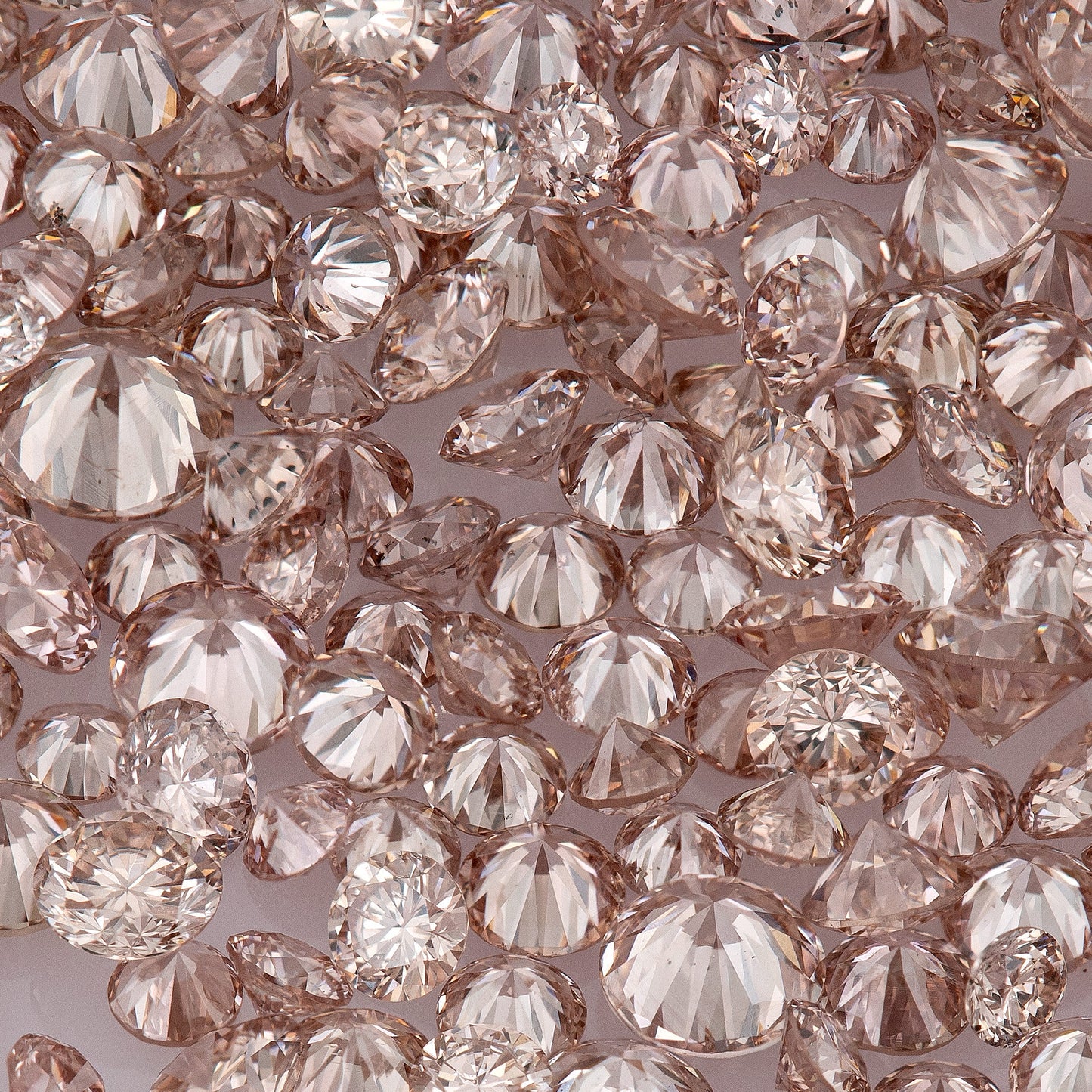 Fancy Intense Pink Champagne PC1 | Argyle Pink Diamonds Select | Untreated Natural Pink Diamonds | Round Melee Accents