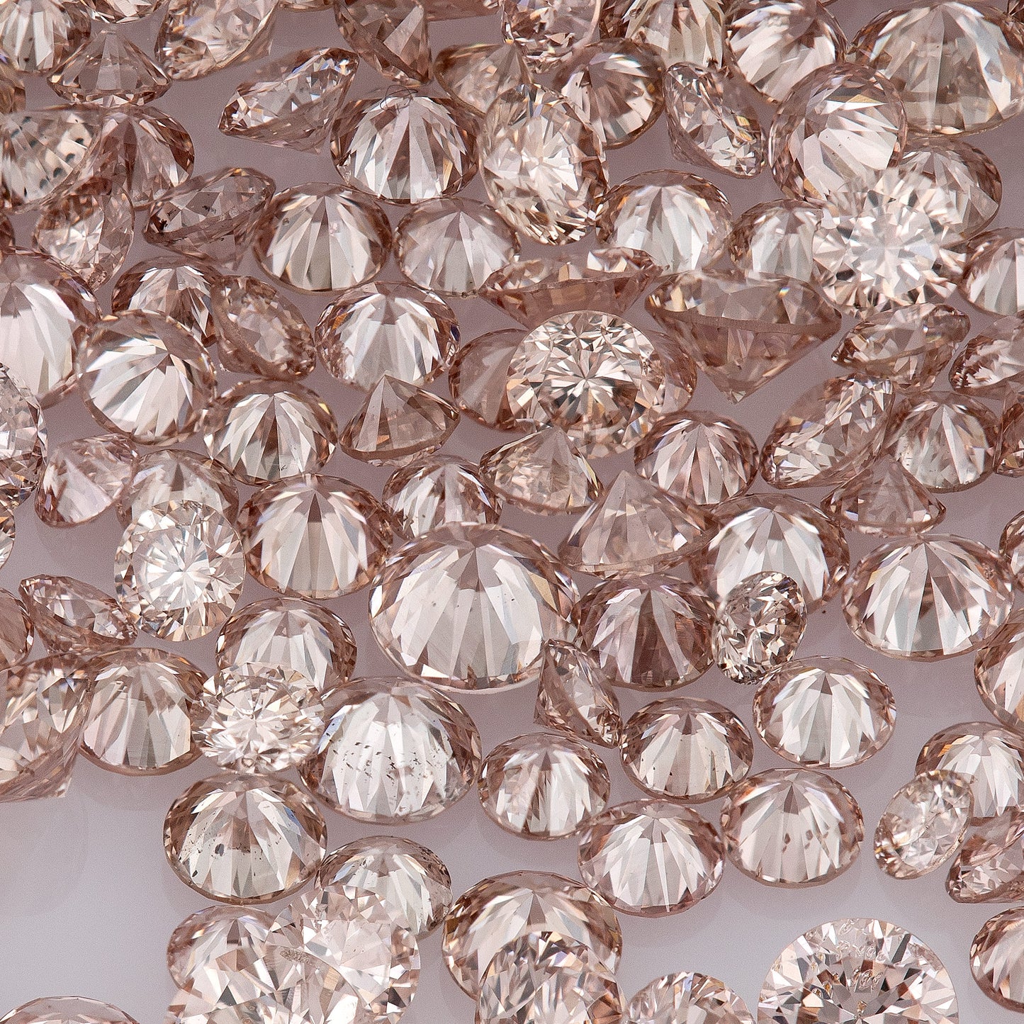 Fancy Intense Pink Champagne PC1 | Argyle Pink Diamonds Select | Untreated Natural Pink Diamonds | Round Melee Accents