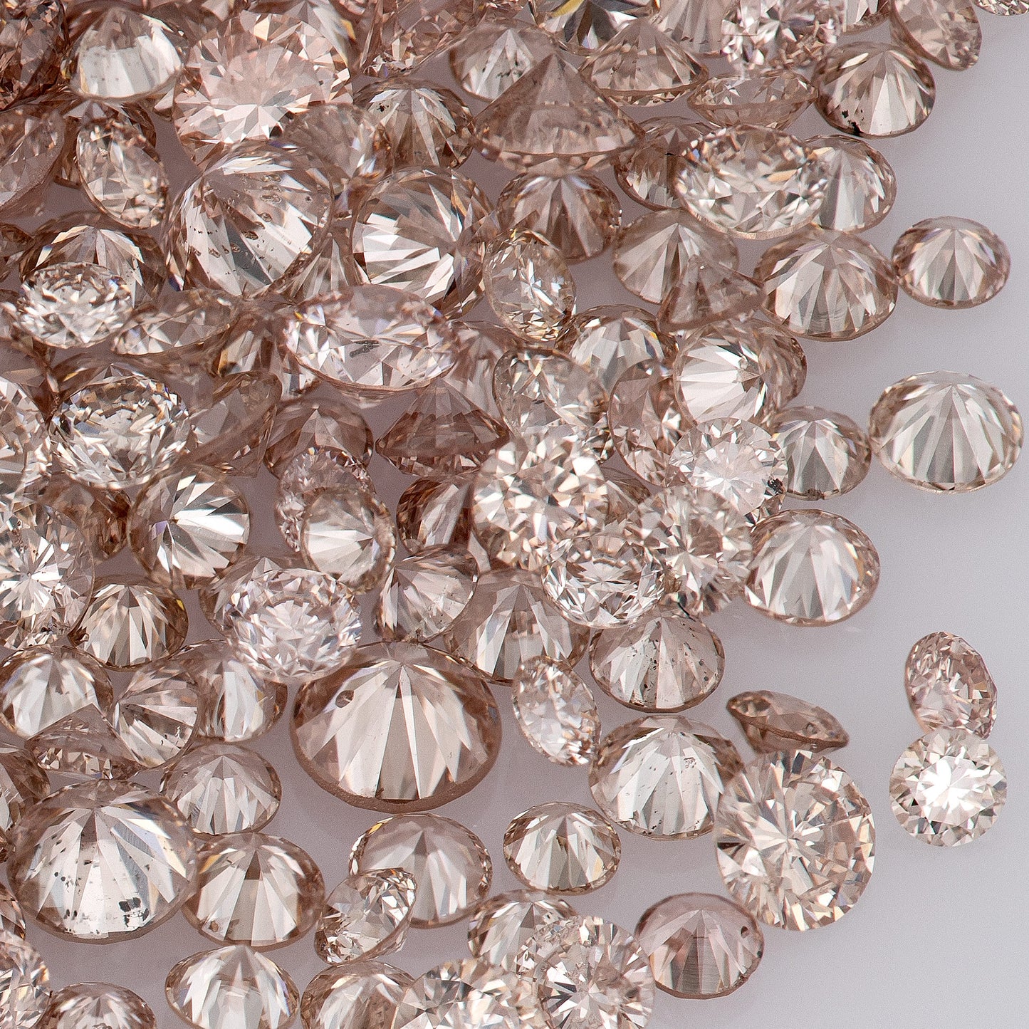 Fancy Intense Pink Champagne PC1-2 | Argyle Pink Diamonds Select | Untreated Natural Pink Diamonds | Round Melee Accents