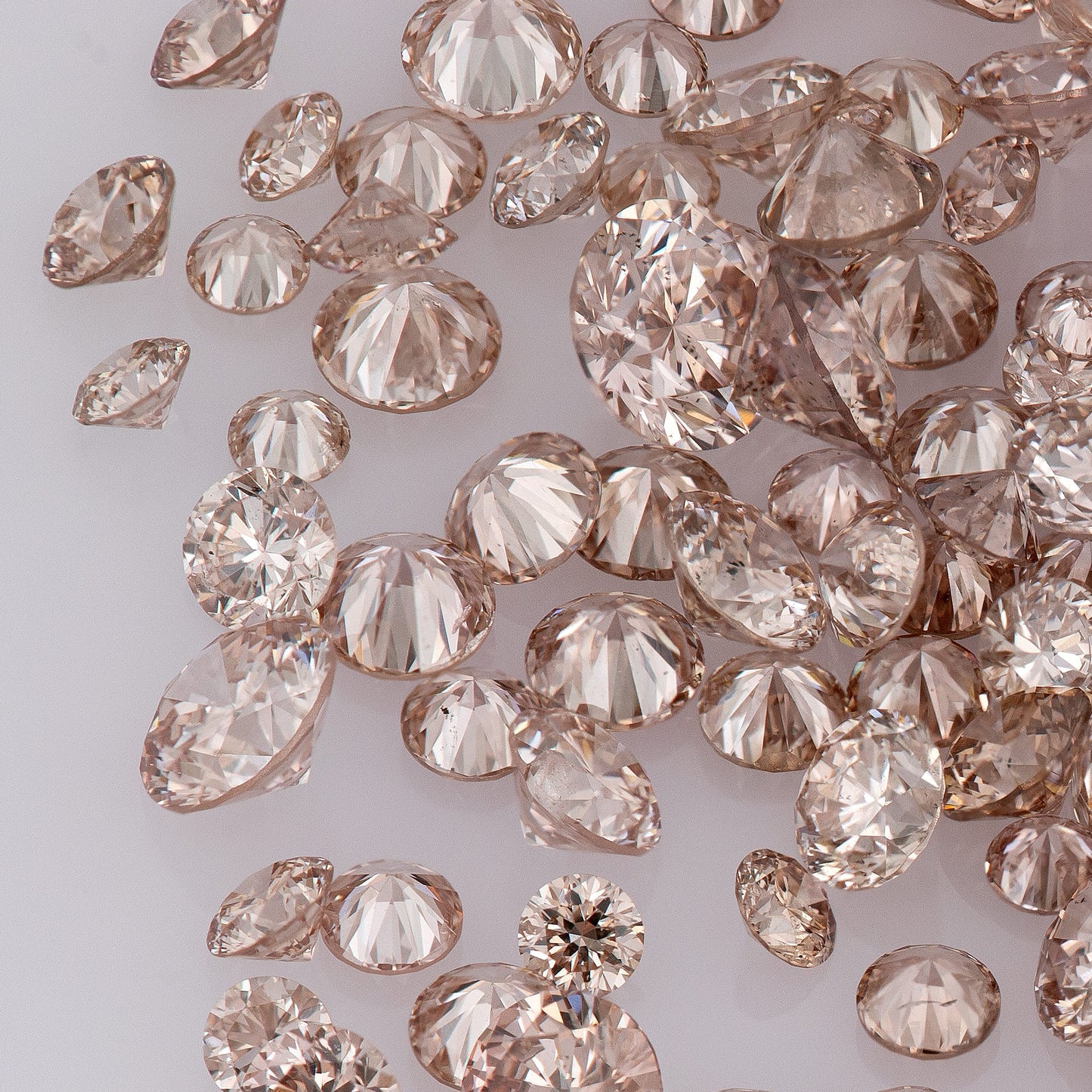 Fancy Intense Pink Champagne PC1-2 | Argyle Pink Diamonds Select | Untreated Natural Pink Diamonds | Round Melee Accents