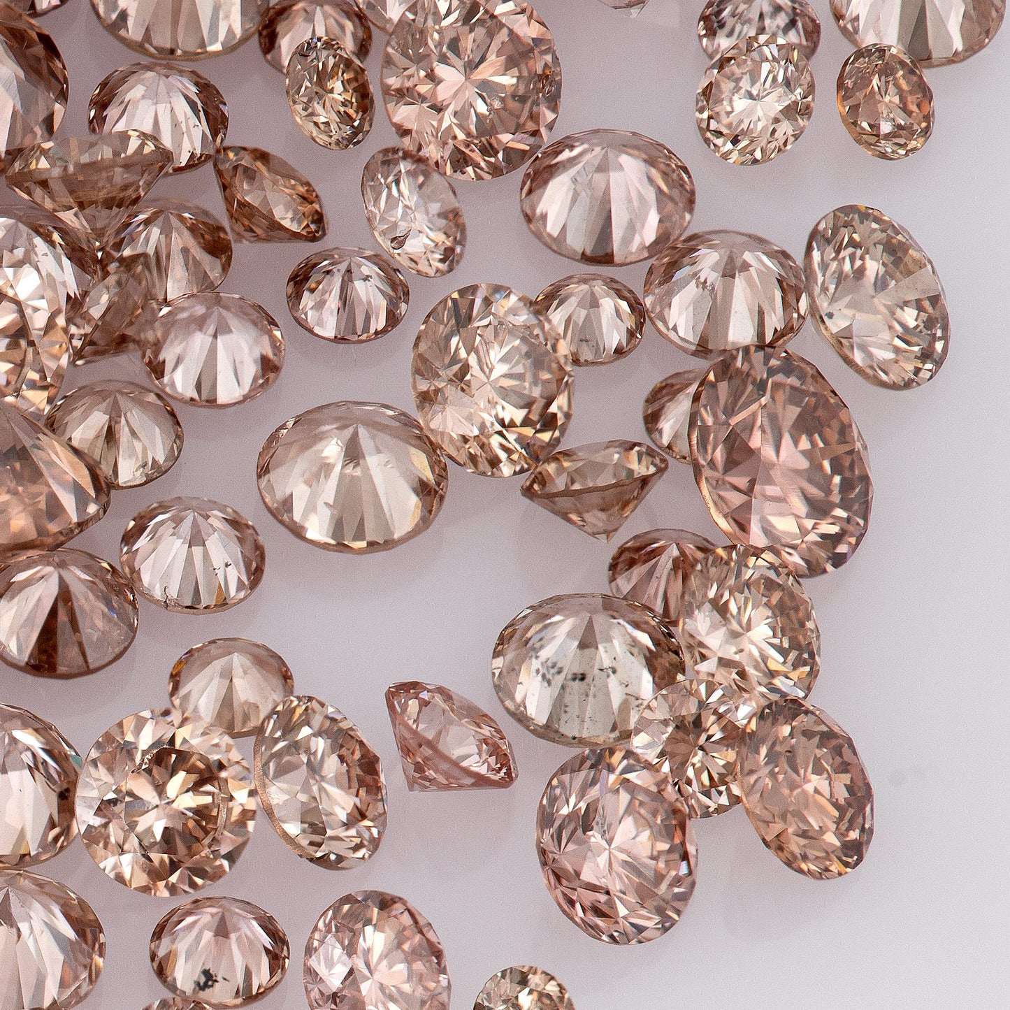 Fancy Intense Pink Champagne PC1/2 | Argyle Pink Diamonds Select | Chocolate Argyle Pink Diamond | Untreated Natural Pink Diamond | Round Melee Accents