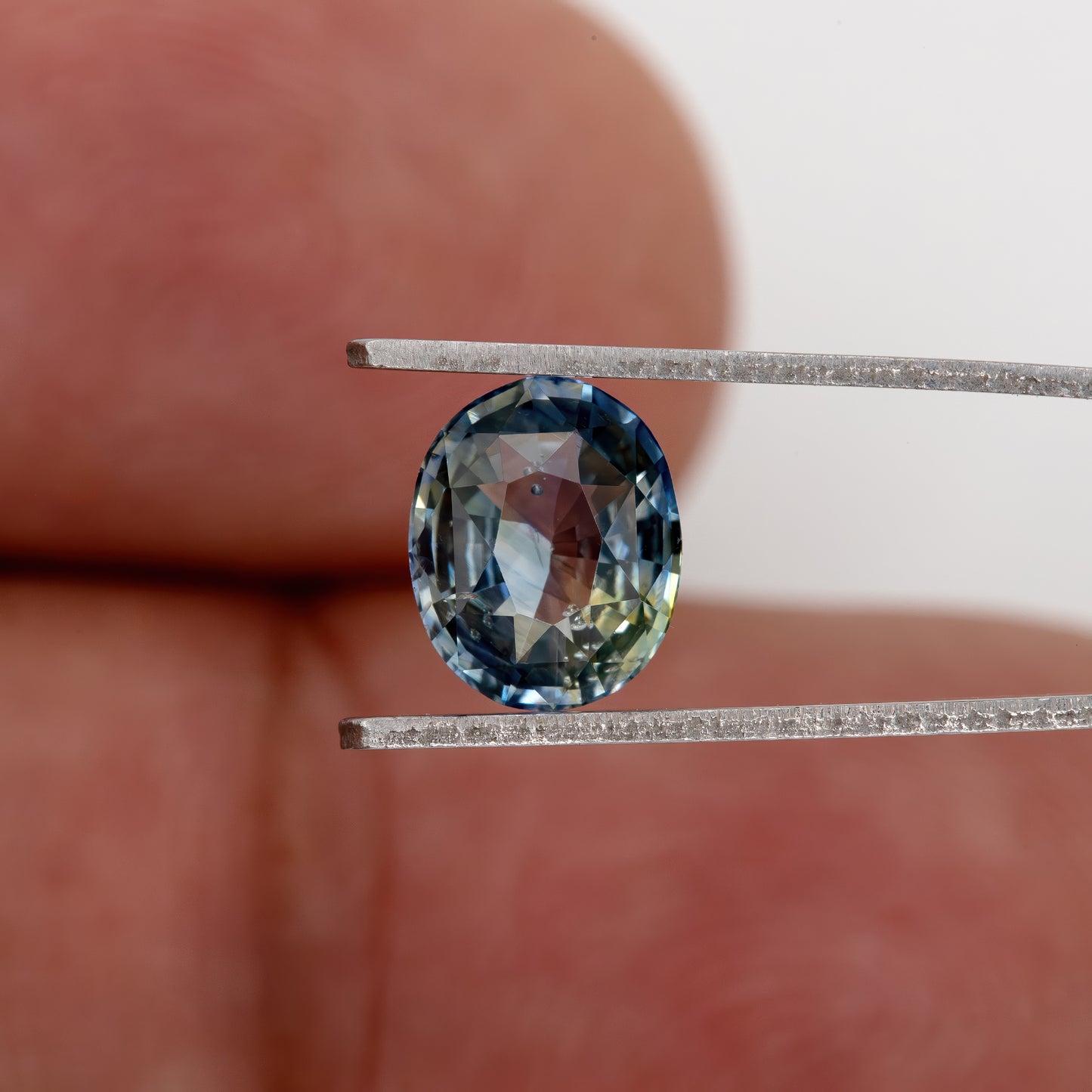 Muted Blue Champagne Bicolor Sapphire | 1.47 Ct Natural Unheated Oval Cut | Eye Clean Gemstone for Fine Jewelry & Rings