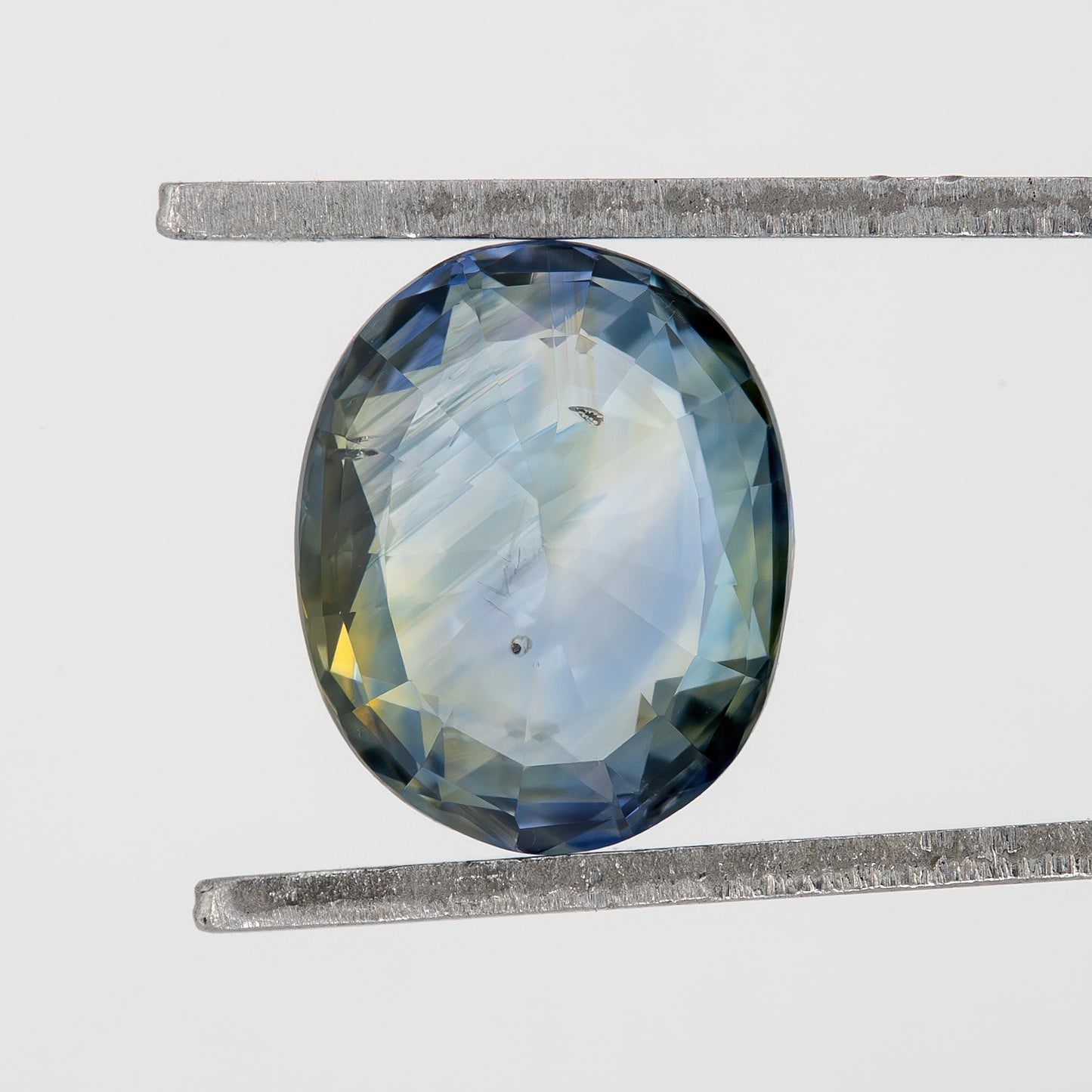 Muted Blue Champagne Bicolor Sapphire | 1.47 Ct Natural Unheated Oval Cut | Eye Clean Gemstone for Fine Jewelry & Rings