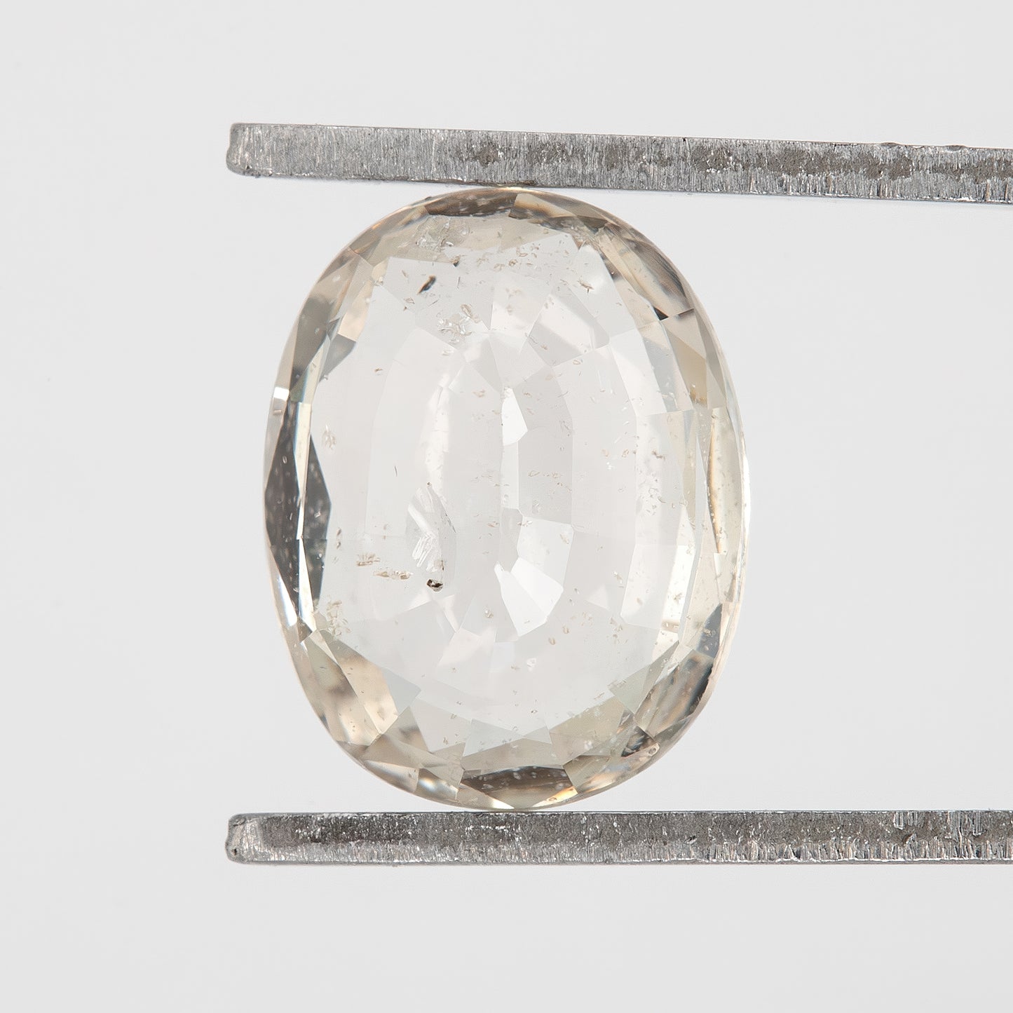 Champagne White | 1.75 Carat Oval Cut Heated Natural Sapphire with Rustic Inclusions for Artisan Jewelry Designs