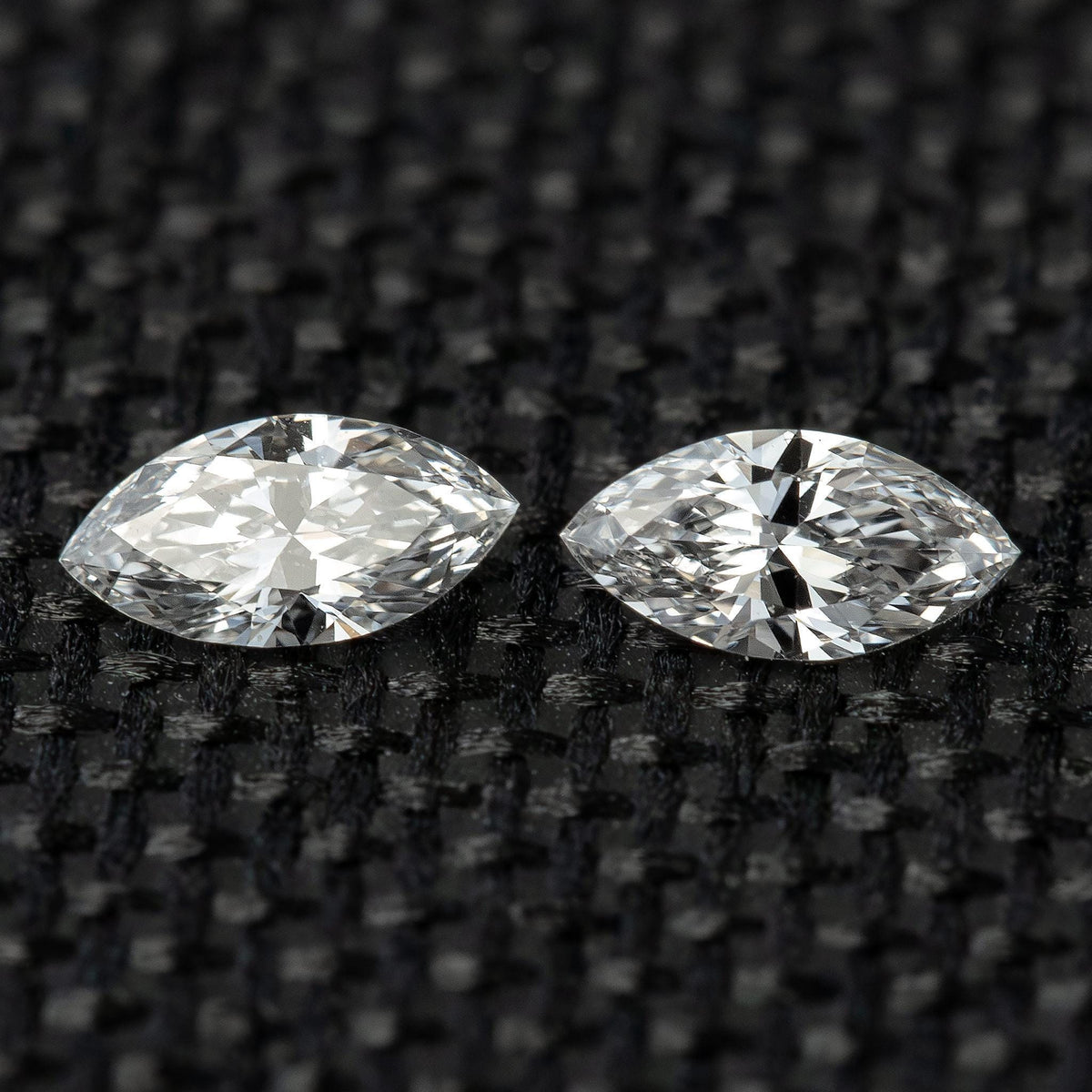 Closely matched pair of 4 x 2 mm natural marquise diamond side stones.