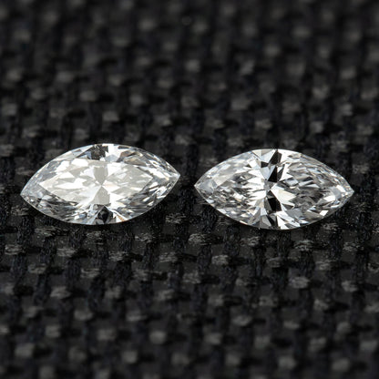Closely matched pair of 4 x 2 mm natural marquise diamond side stones.