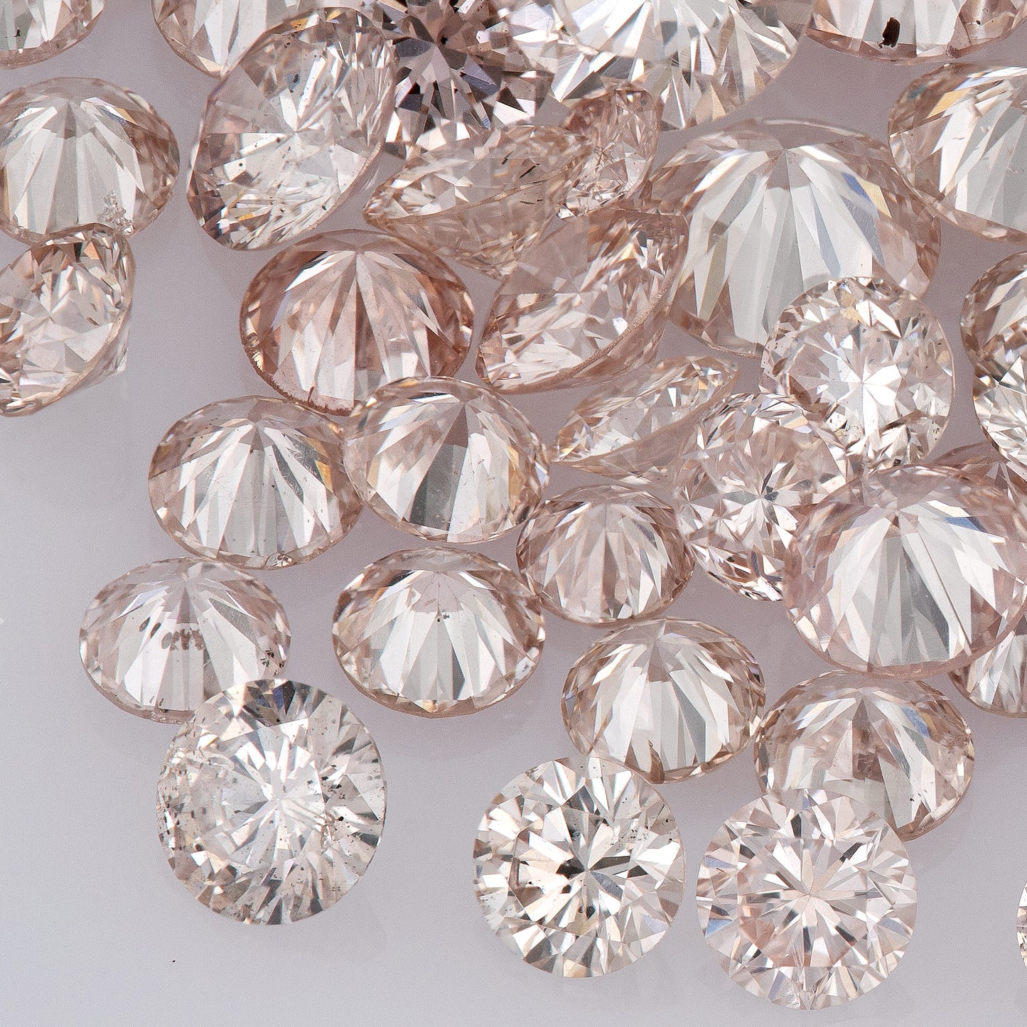 Fancy Light Pink Rose (9-8PR) | Argyle Pink Rosé Diamonds | Pink Untreated Natural Diamonds | Round | Melee | Accents | Cape Yellow