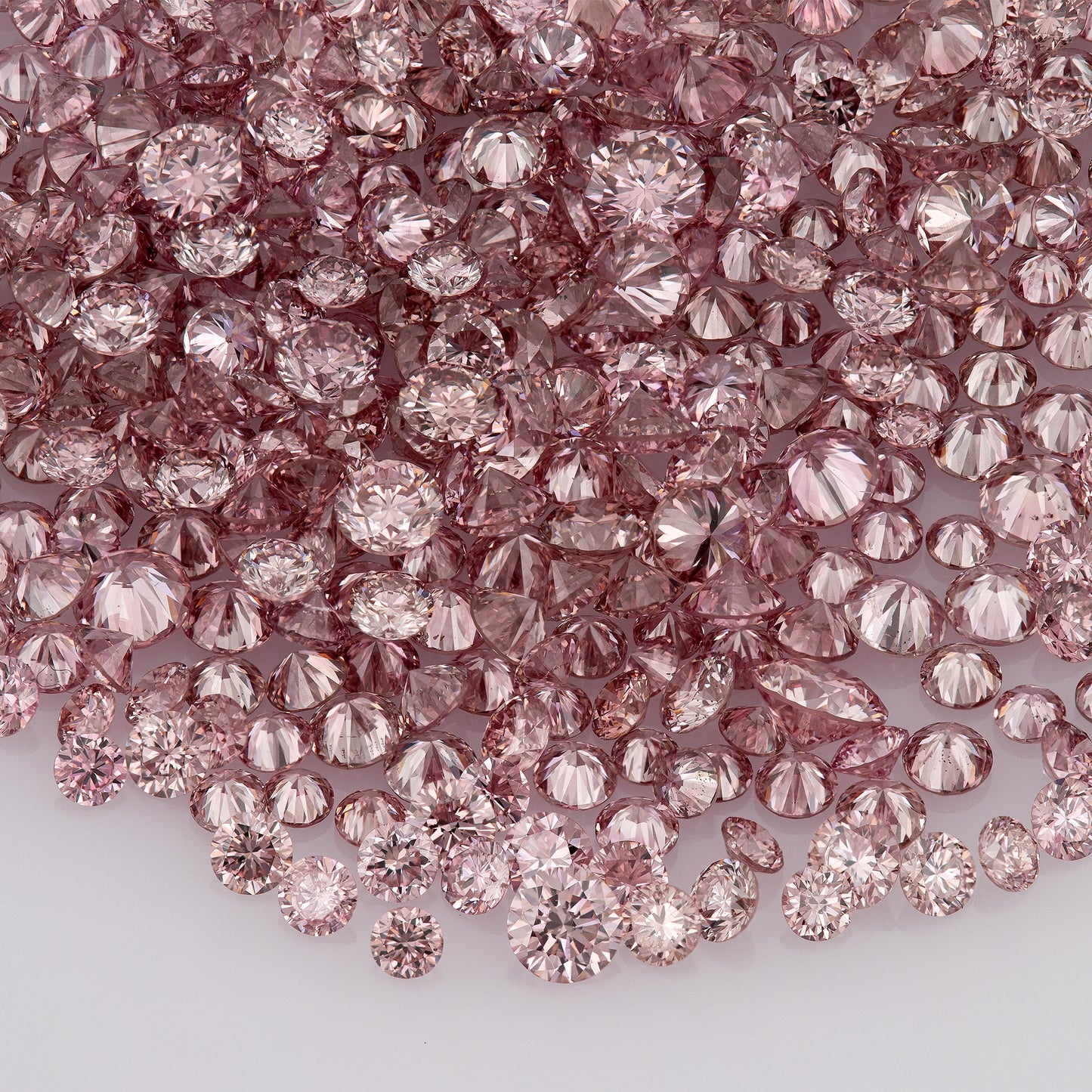 Fancy Vivid Pink Rose AA (4PR) | Argyle Vivid Pink Rose Diamonds | Argyle Pink Diamond | Untreated Natural Pink Diamonds | Round | Melee | Accents | Argyle