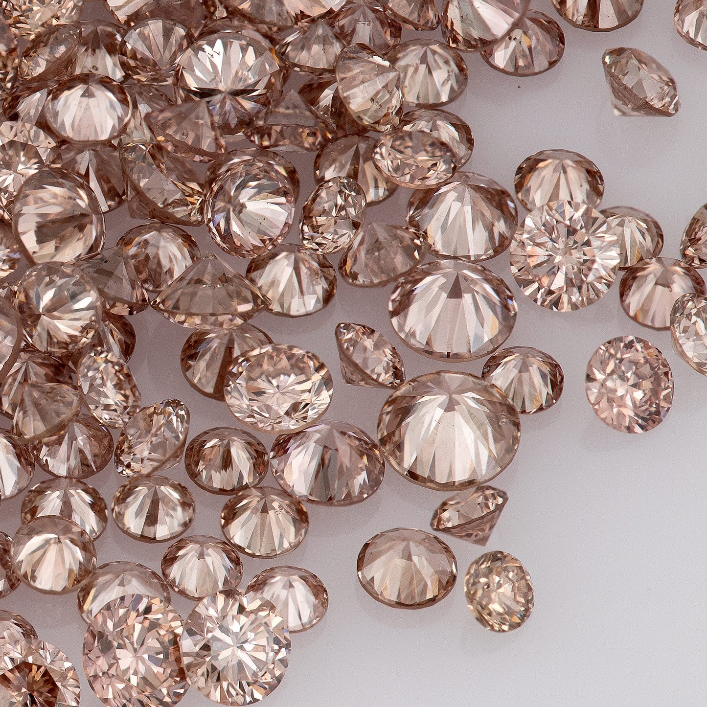 Fancy Vivid Pink Champagne PC2 | Argyle Pink Diamonds Select | Untreated Natural Pink Diamonds | Round Melee Accents
