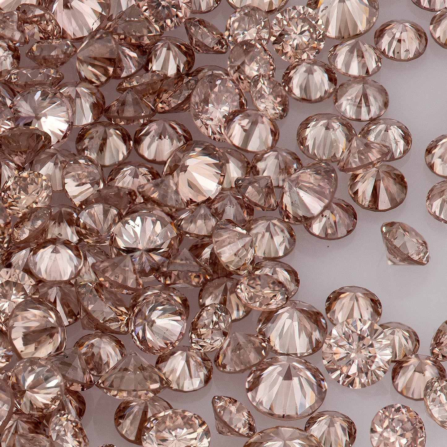 Fancy Vivid Pink Champagne PC2 | Argyle Pink Diamonds Select | Untreated Natural Pink Diamonds | Round Melee Accents