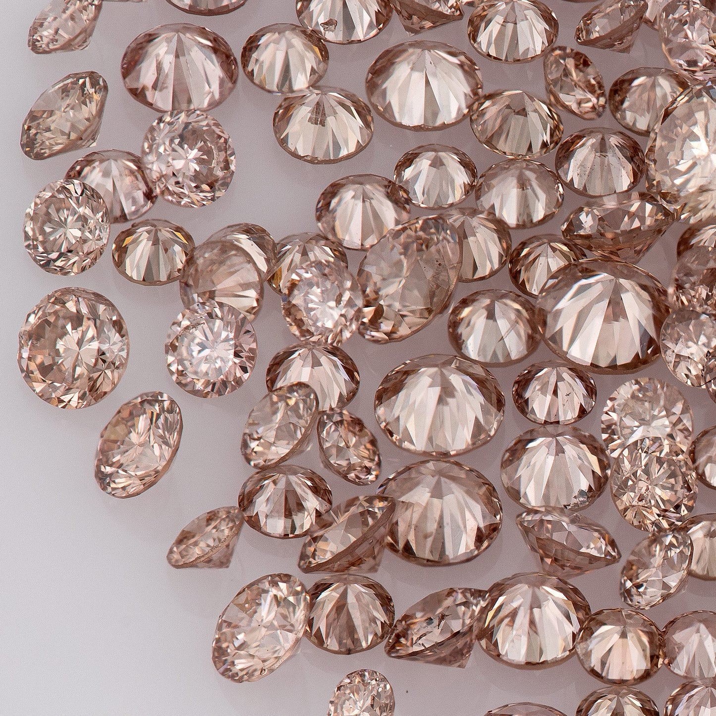 Fancy Vivid Pink Champagne PC2 | Argyle Pink Diamonds Select | Untreated Natural Pink Diamonds | Round Melee Accents