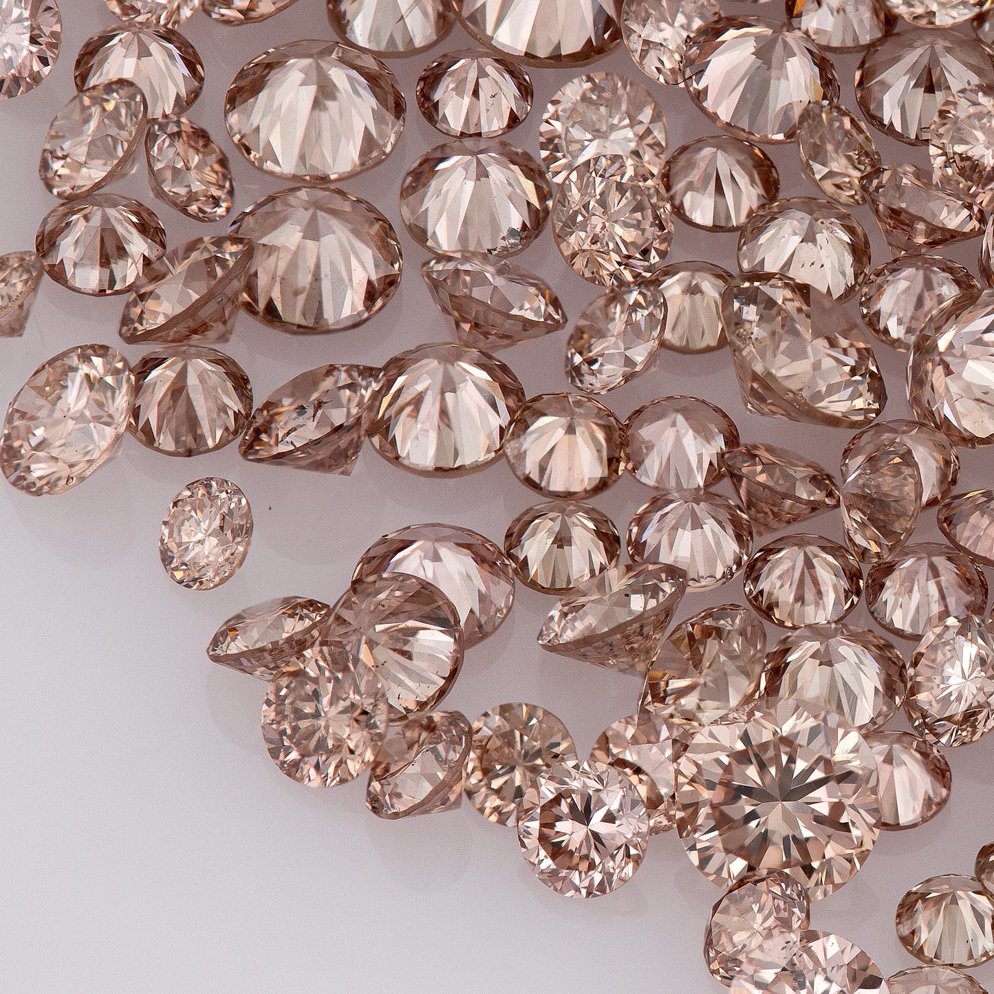Fancy Vivid Pink Champagne PC2 | Argyle Pink Diamonds Select | Untreated Natural Pink Diamonds | Round Melee Accents