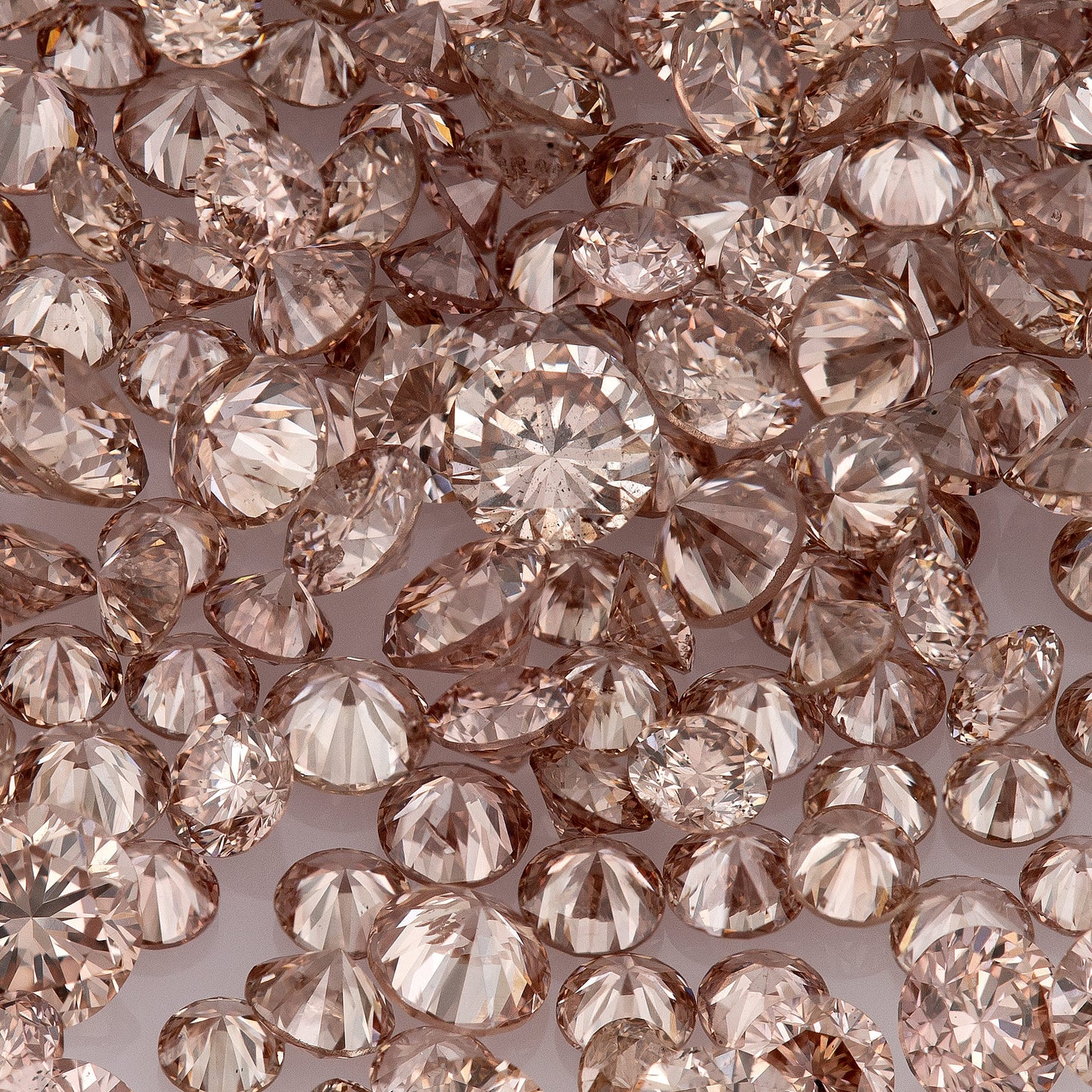 Fancy Vivid Pink Champagne PC2 | Argyle Pink Diamonds Select | Untreated Natural Pink Diamonds | Round Melee Accents