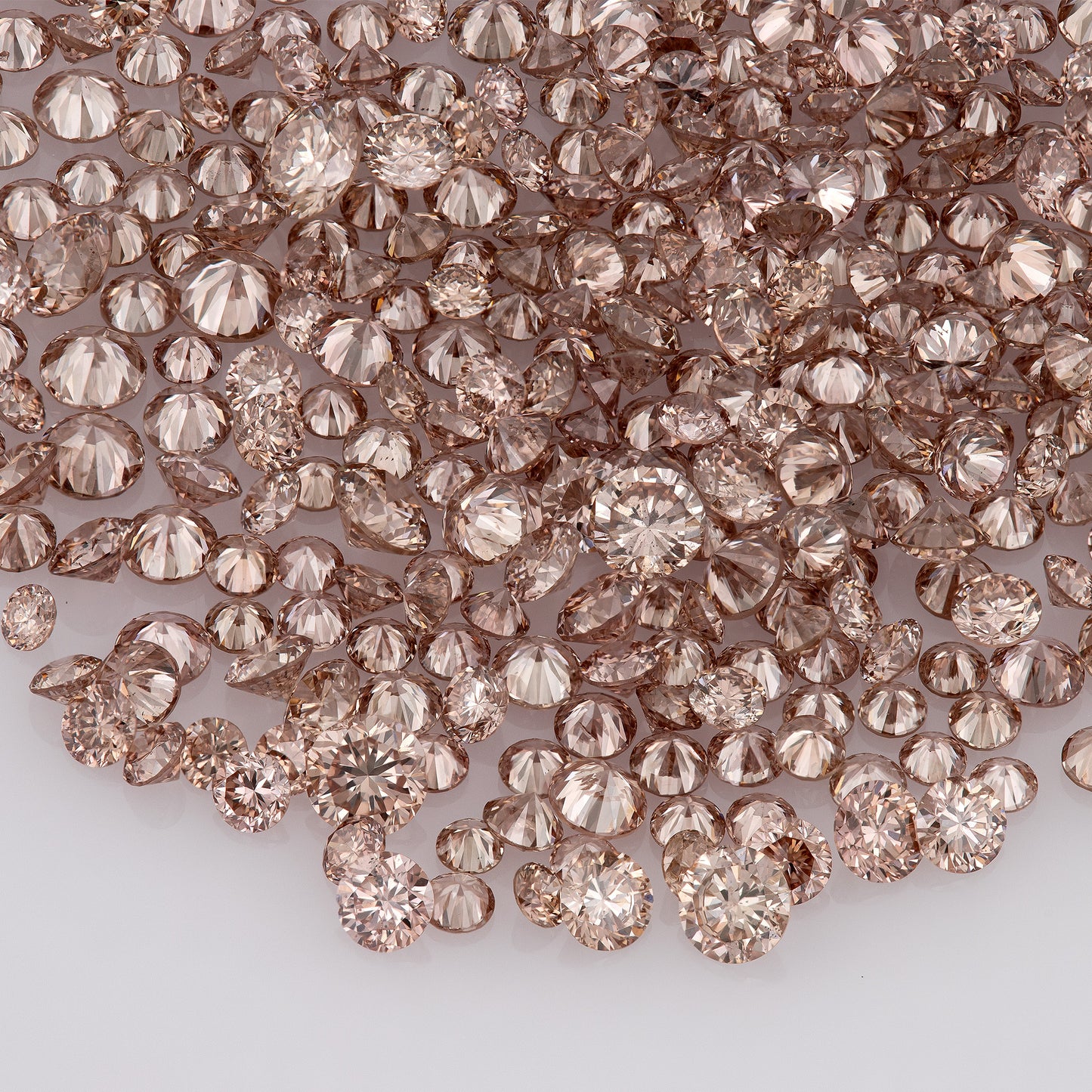 Fancy Vivid Pink Champagne PC2 | Argyle Pink Diamonds Select | Untreated Natural Pink Diamonds | Round Melee Accents