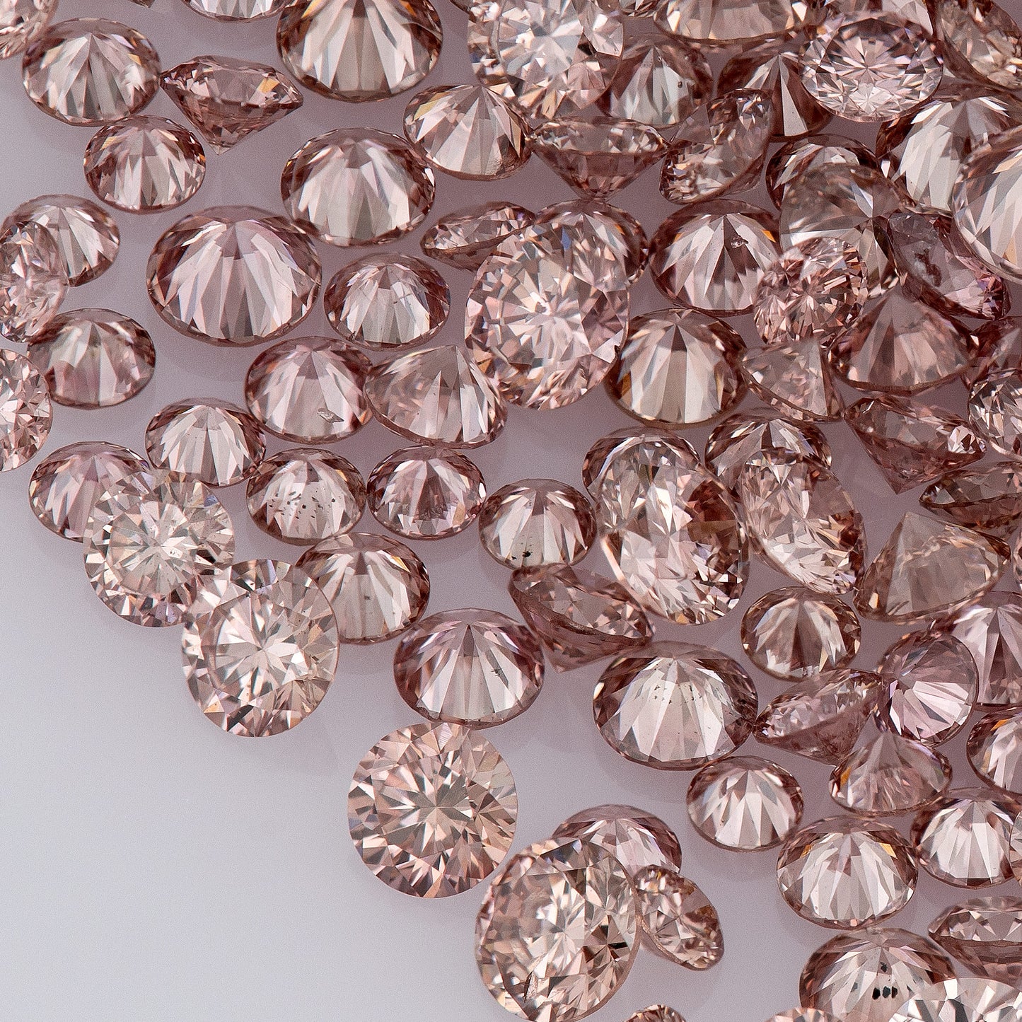 Fancy Vivid Pink Champagne PC2 | Argyle Pink Diamonds Select | Untreated Natural Pink Diamond | Round Melee Accents