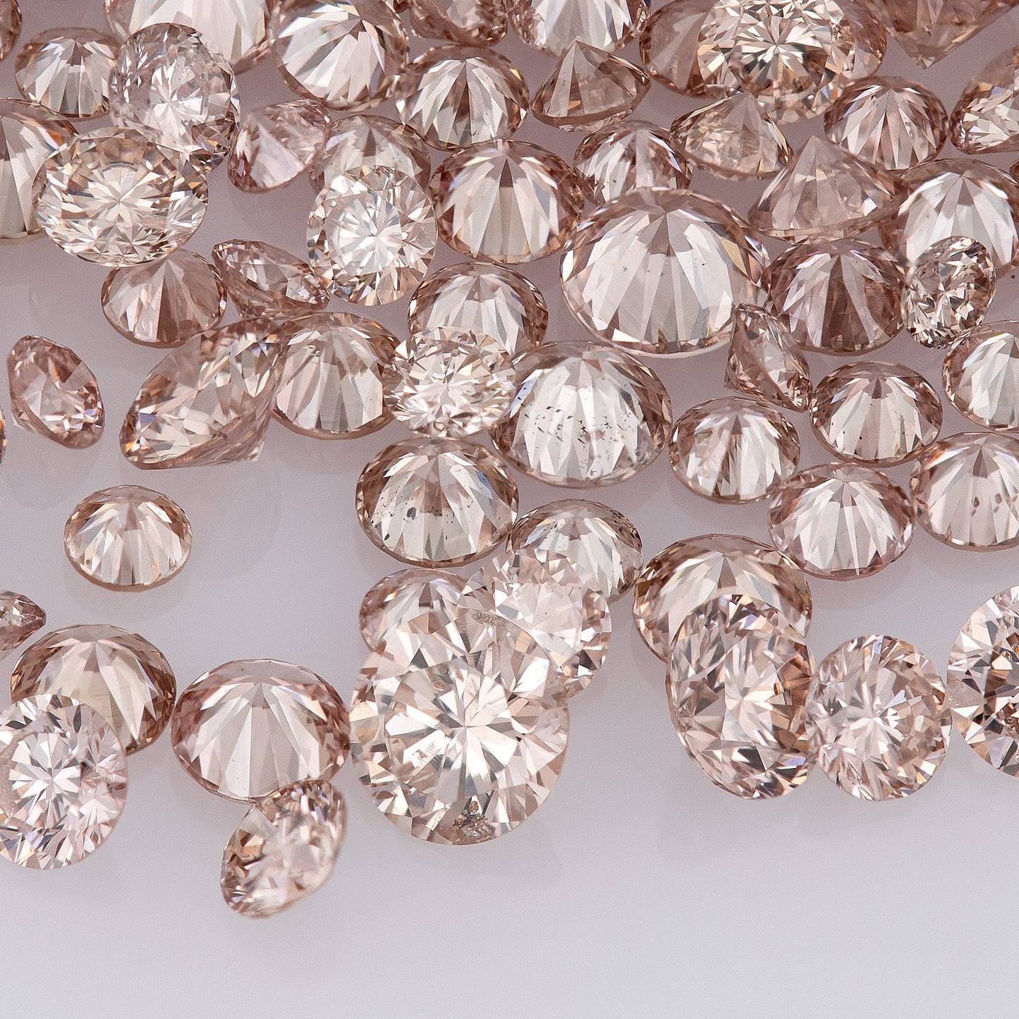 Fancy Intense Pink Champagne PC1 | Argyle Pink Diamonds Select | Untreated Natural Pink Diamonds | Round Melee Accents
