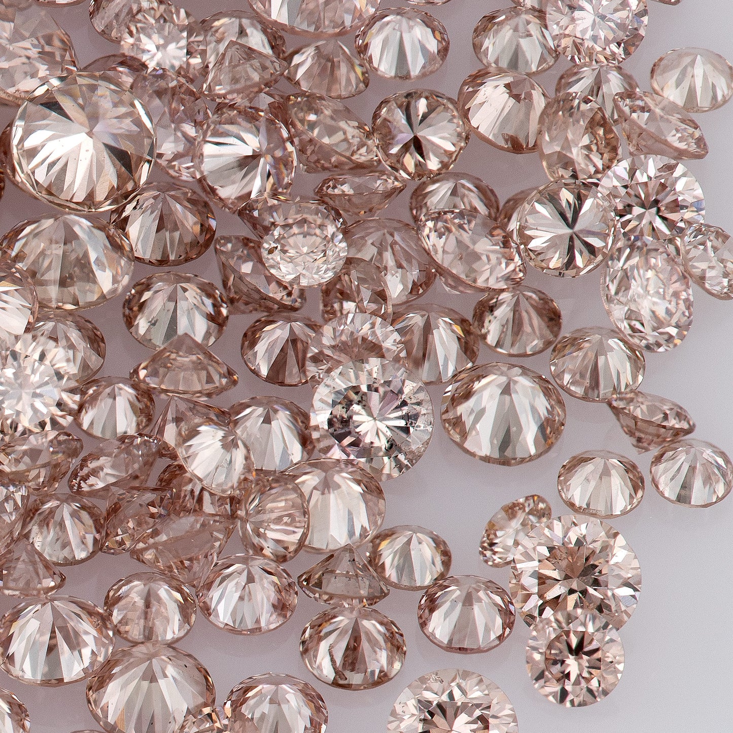 Fancy Intense Pink Champagne PC1 | Argyle Pink Diamonds Select | Untreated Natural Pink Diamonds | Round Melee Accents
