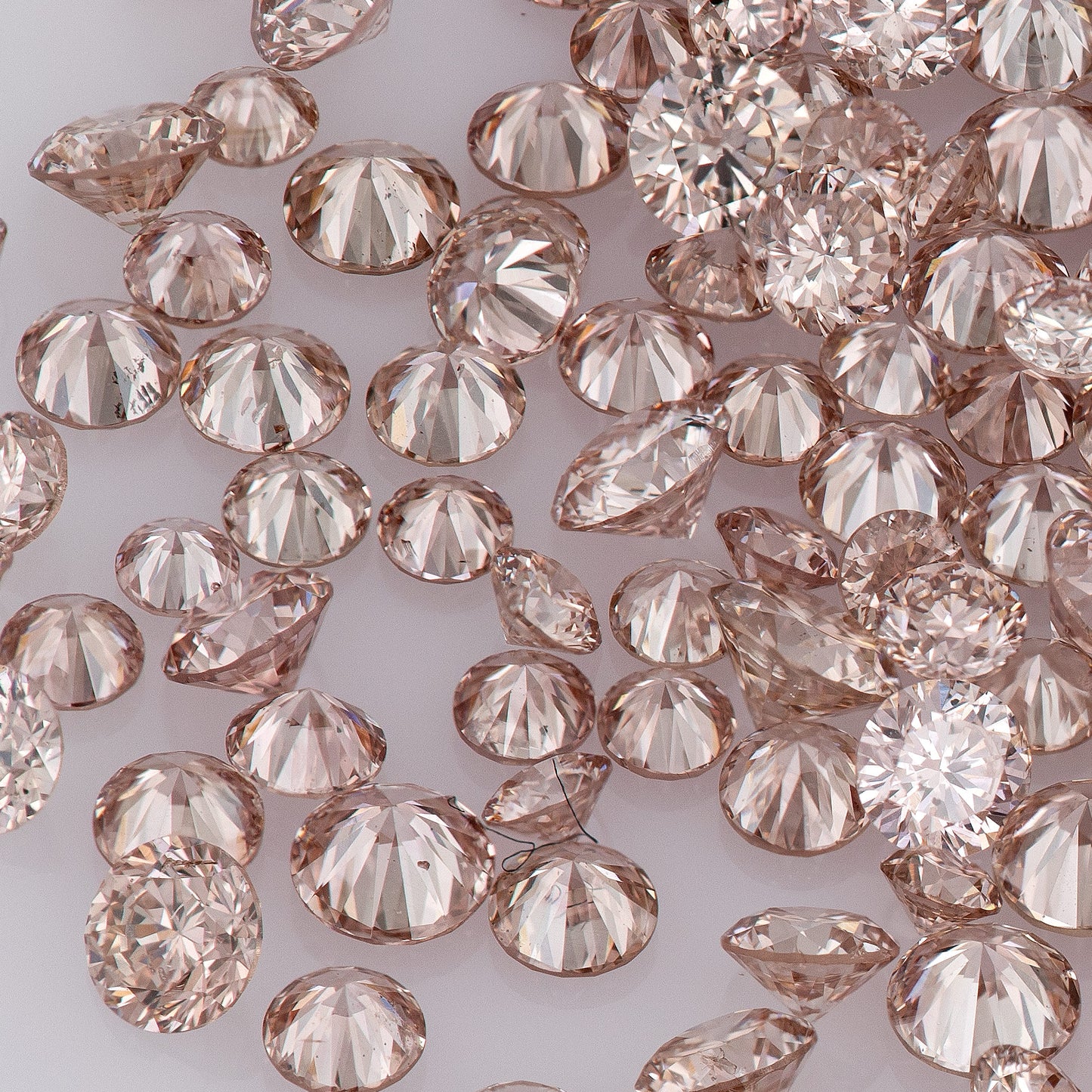 Fancy Intense Pink Champagne PC1 | Argyle Pink Diamonds Select | Untreated Natural Pink Diamonds | Round Melee Accents