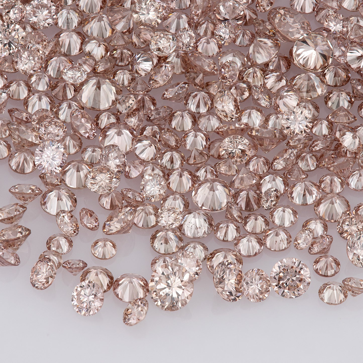 Fancy Intense Pink Champagne PC1 | Argyle Pink Diamonds Select | Untreated Natural Pink Diamonds | Round Melee Accents
