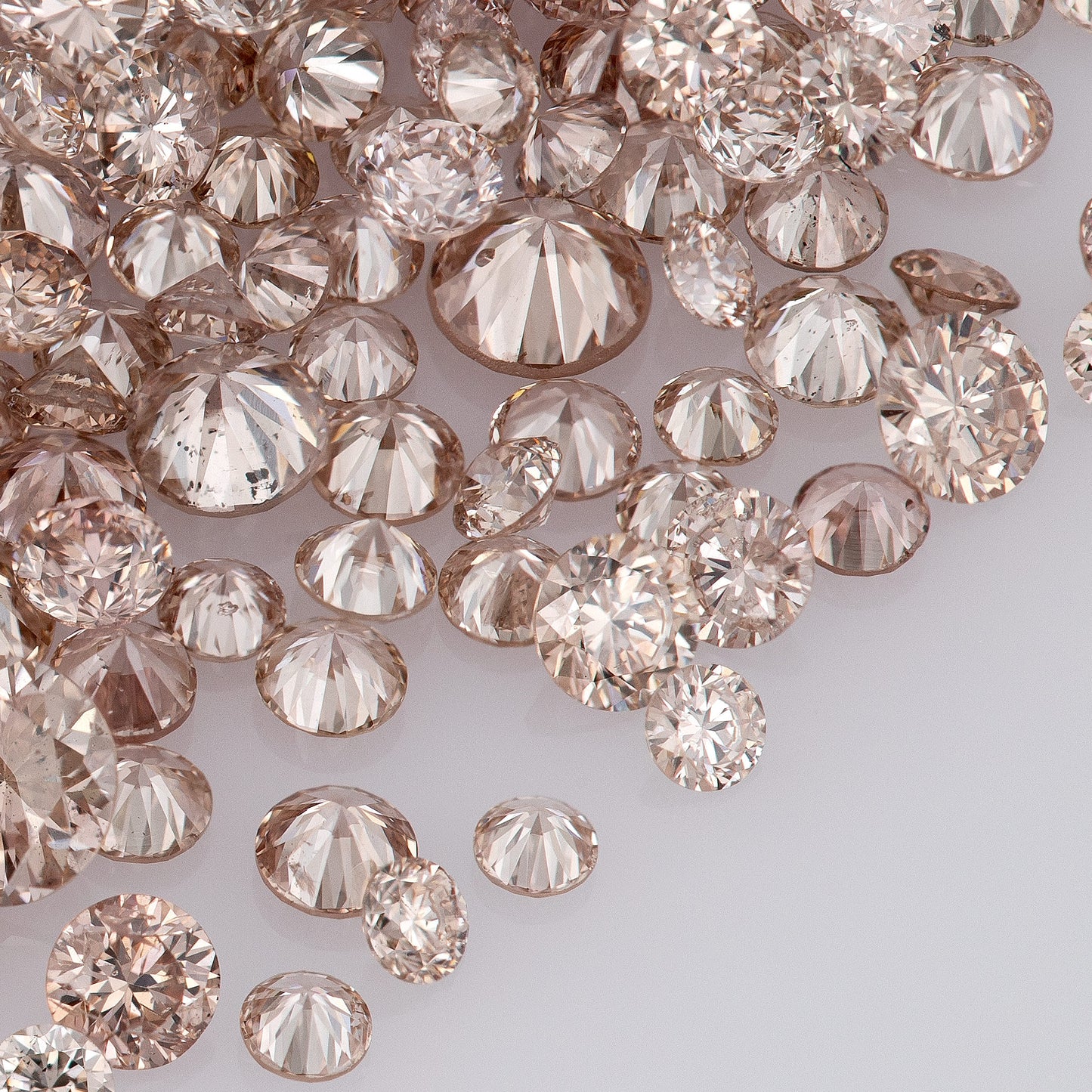 Fancy Intense Pink Champagne PC1-2 | Argyle Pink Diamonds Select | Untreated Natural Pink Diamonds | Round Melee Accents
