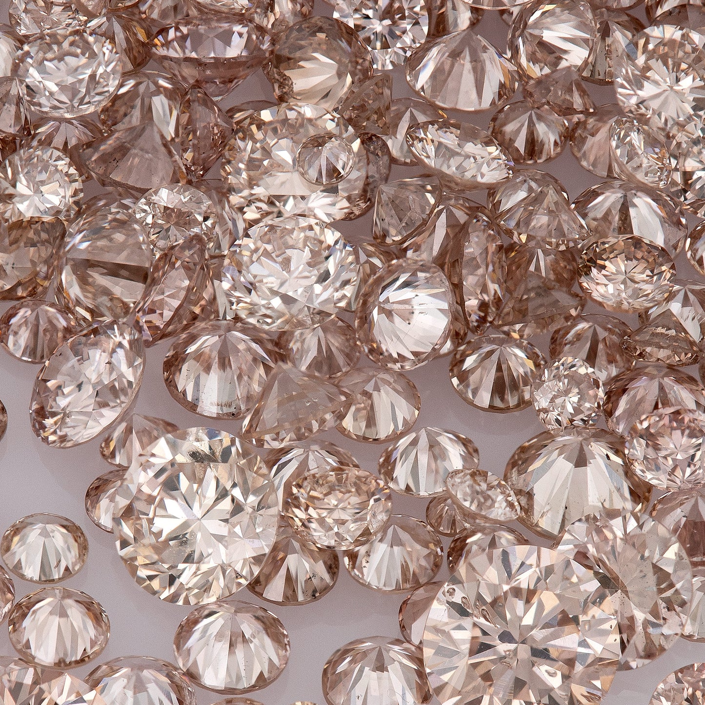 Fancy Intense Pink Champagne PC1-2 | Argyle Pink Diamonds Select | Untreated Natural Pink Diamonds | Round Melee Accents
