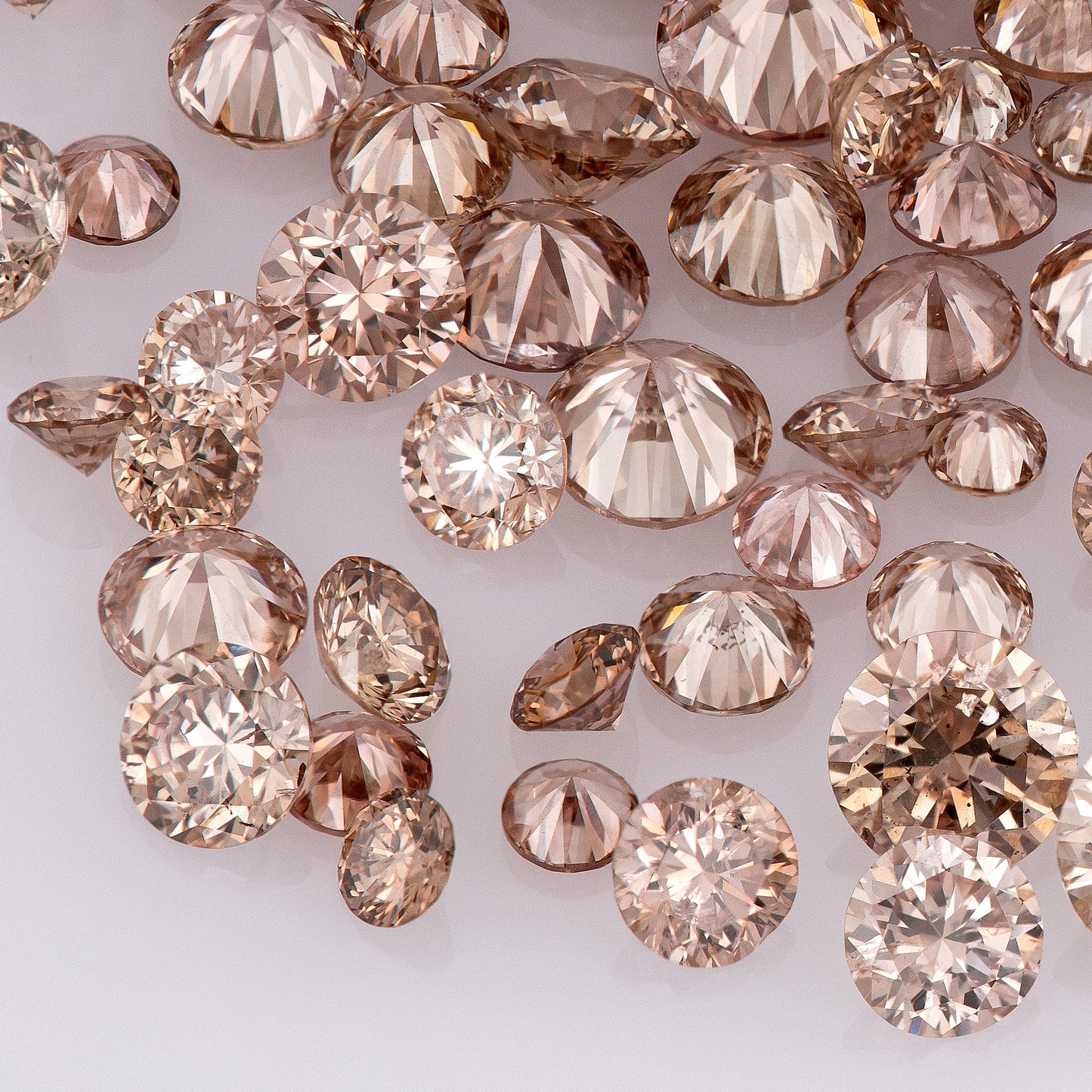 Fancy Intense Pink Champagne PC1/2 | Argyle Pink Diamonds Select | Chocolate Argyle Pink Diamond | Untreated Natural Pink Diamond | Round Melee Accents