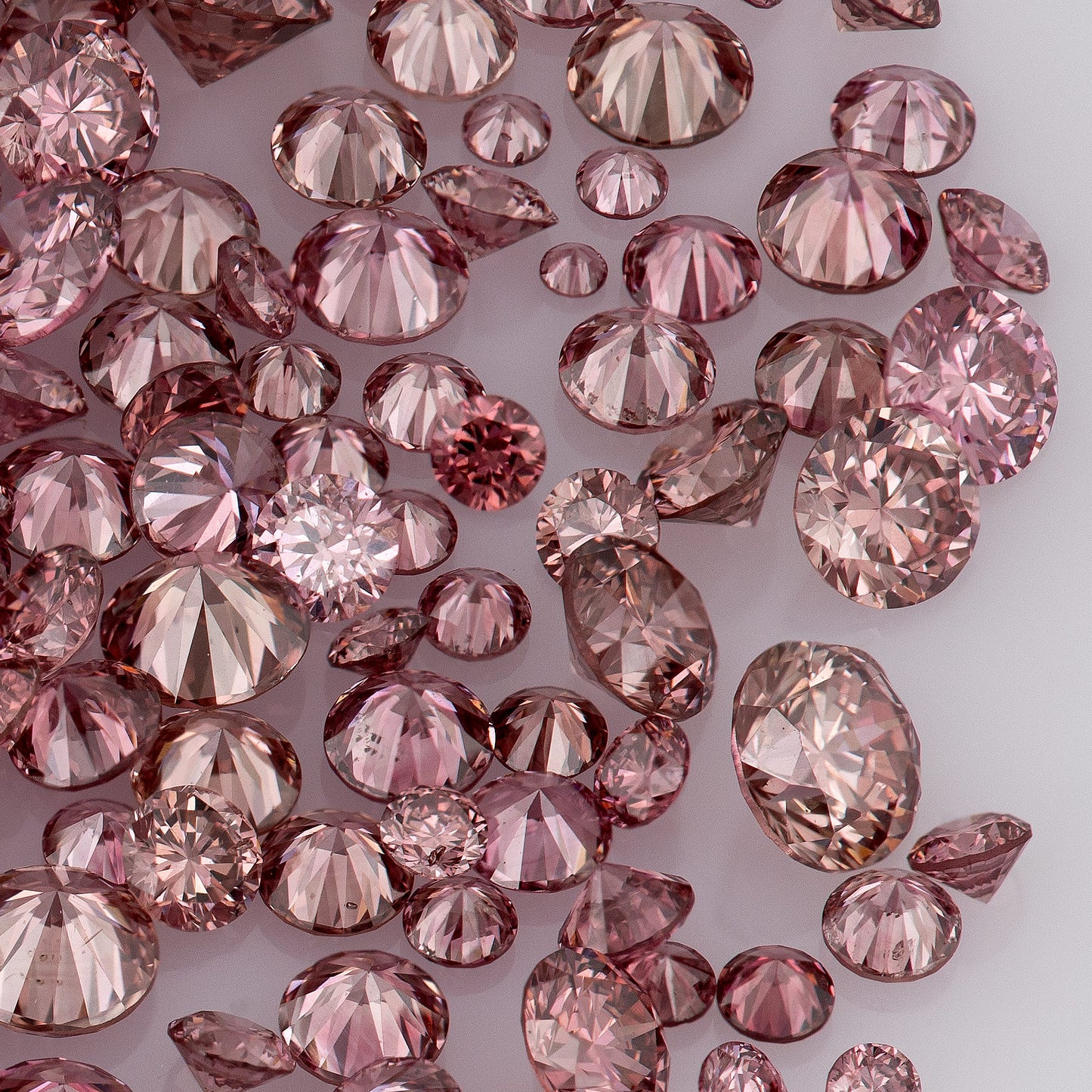 Fancy VIVID Reddish/Pink Rose Argyle (PR5-3 - PC2-3) | Argyle Pink Diamonds Select | Untreated Natural Pink Diamond | Round Melee Accents