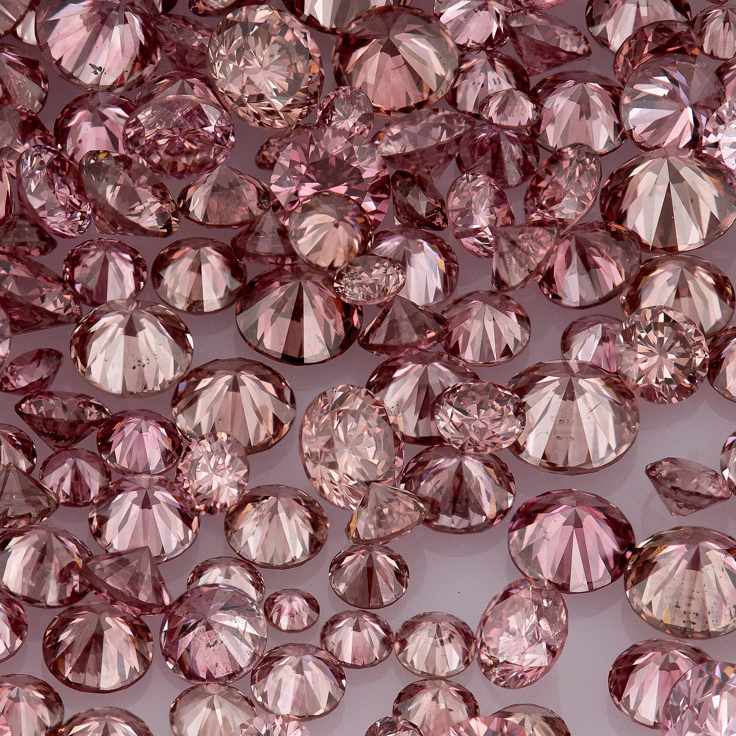 Fancy VIVID Reddish/Pink Rose Argyle (PR5-3 - PC2-3) | Argyle Pink Diamonds Select | Untreated Natural Pink Diamond | Round Melee Accents