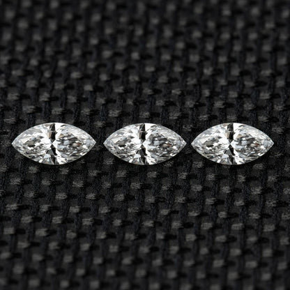 Three matched 4 x 2 mm natural marquise diamonds arranged in a row.