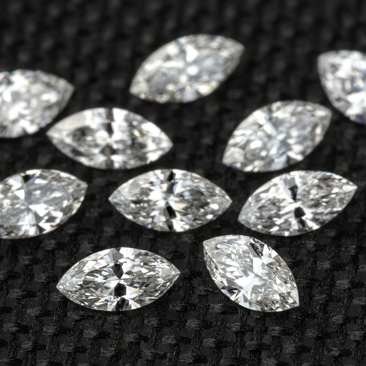 Close angled group view showing full brilliant marquise faceting.