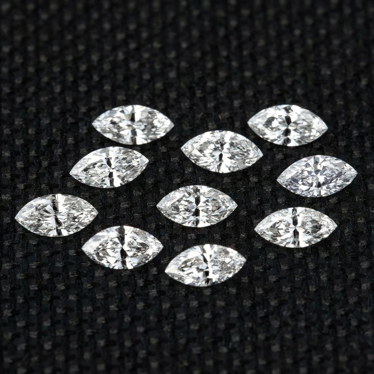 Full group of calibrated 4 x 2 mm natural marquise diamond side stones.