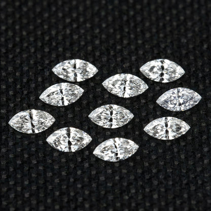 Full group of calibrated 4 x 2 mm natural marquise diamond side stones.