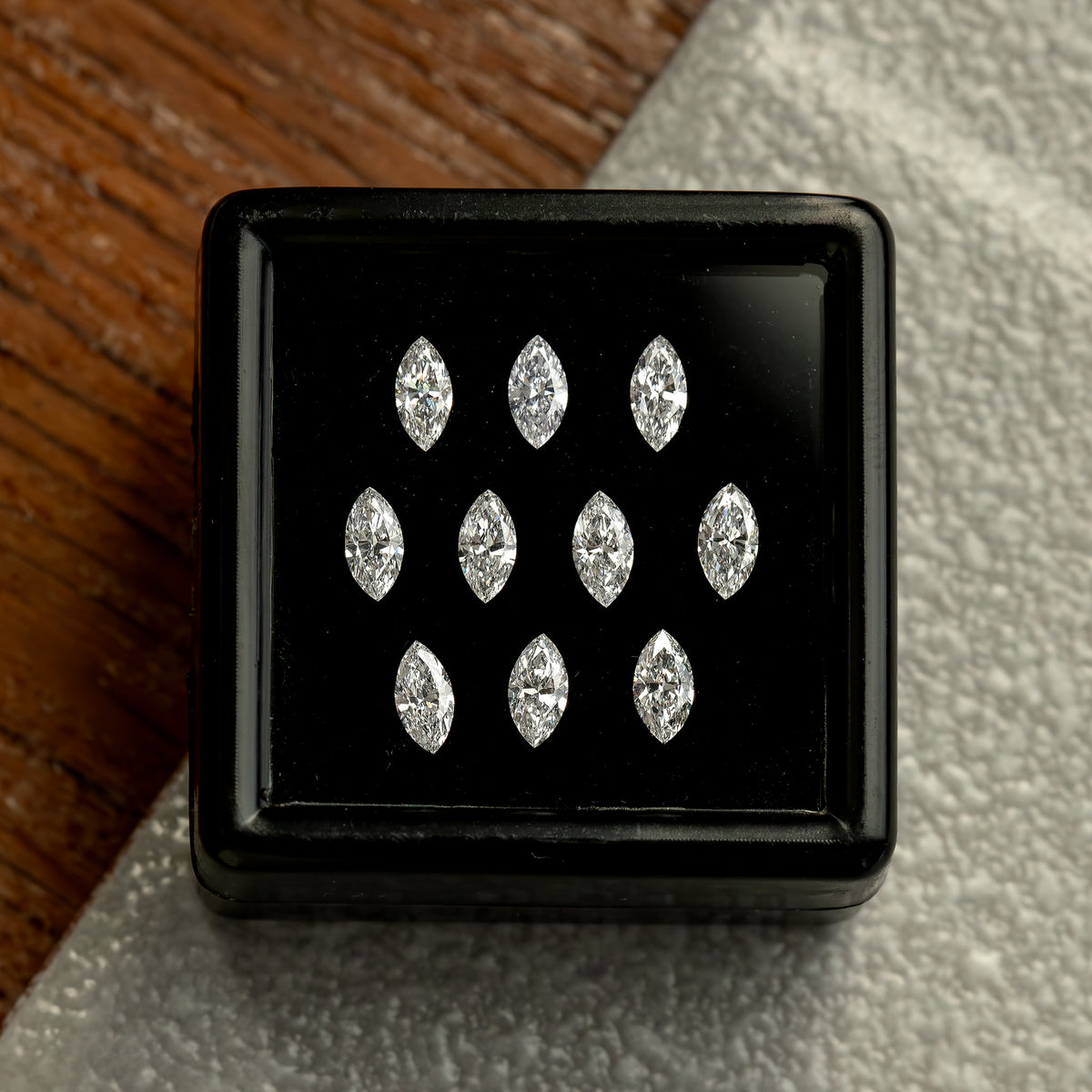Ten marquise diamonds in a black box against a gray background, showing an alternate reference-parcel view.