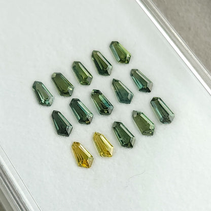 Close tilted view of the sapphire rows, showing green and yellow reflections.