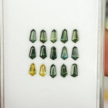 Face-up tray view of the three sapphire rows from a slightly wider distance.