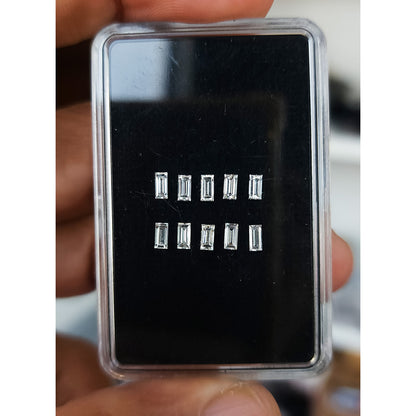 Representative calibrated baguette diamonds arranged inside a gem box.