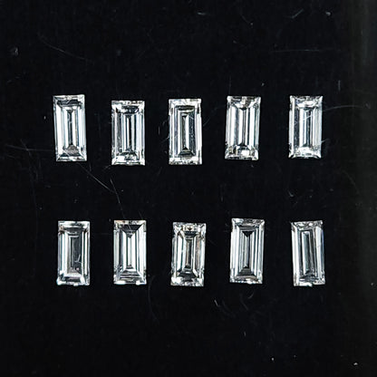 Representative natural baguette step-cut diamonds arranged face up on a dark background; sold per piece.