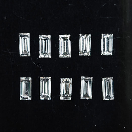 Representative natural baguette step-cut diamonds arranged face up on a dark background; sold per piece.