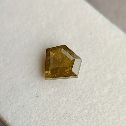 The second usable side of the shield-shaped natural diamond, showing a broader central facet pattern and visible inclusions.