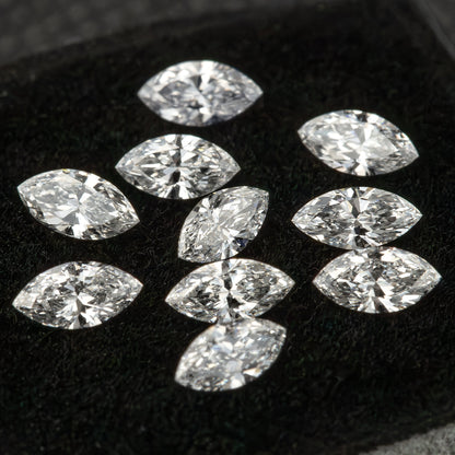 Loose marquise diamonds arranged across black velvet, showing the range of reflected patterns within the reference parcel.