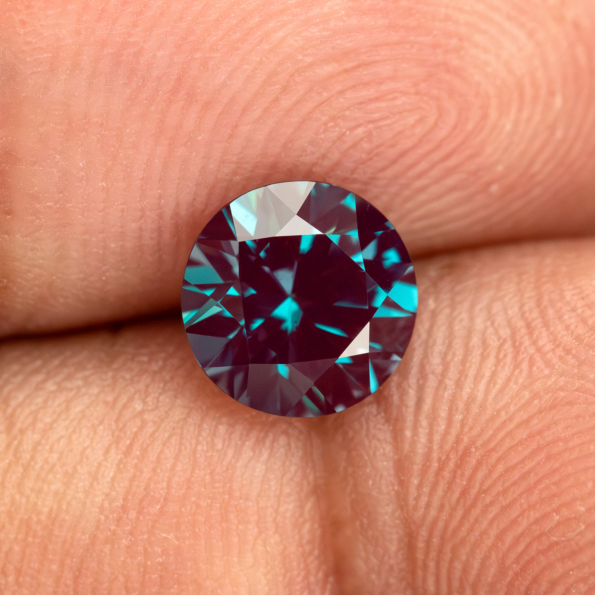 Round sample on fingertips to provide scale context for the calibrated design.