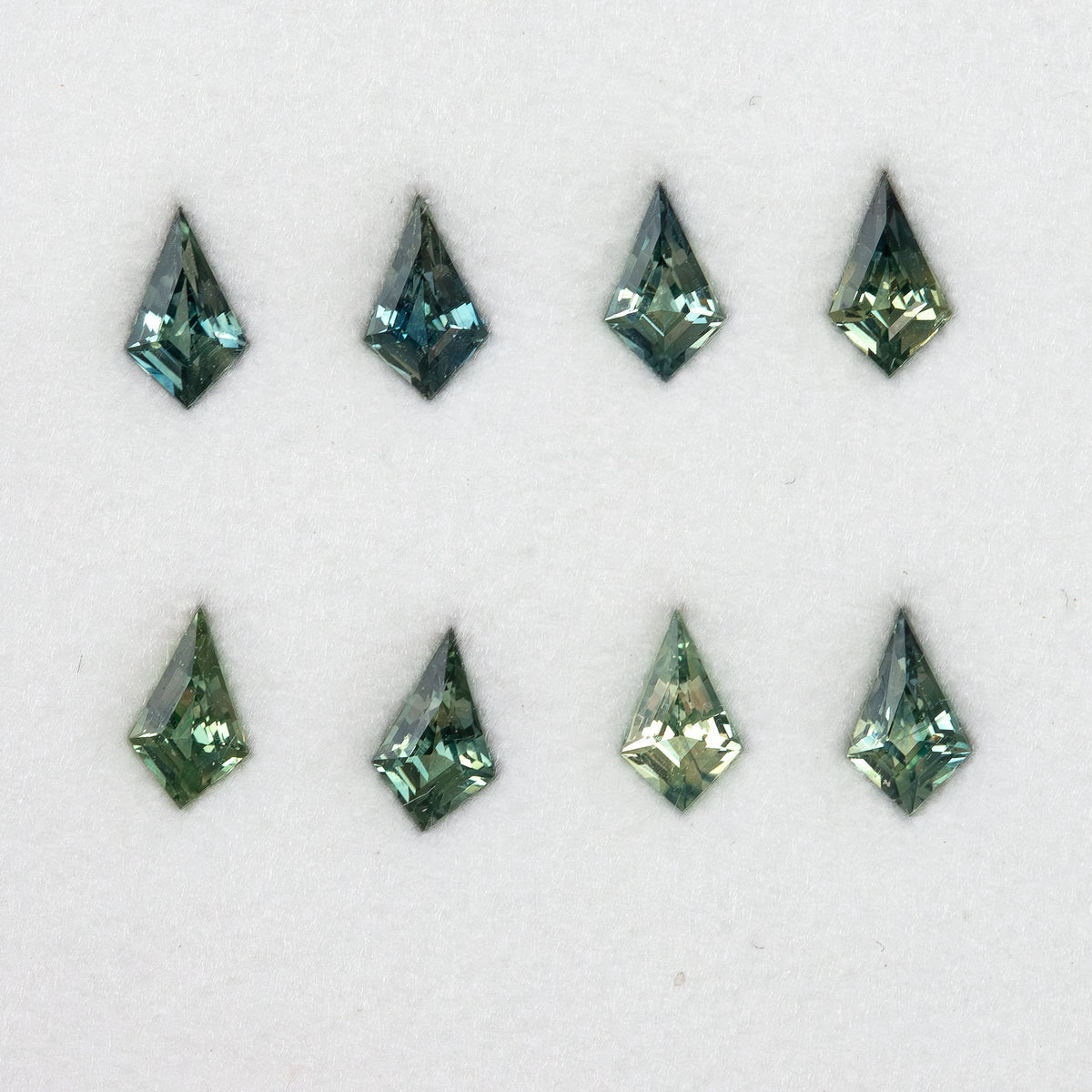 Original sapphire group shown in two rows, with varied green and teal tones.