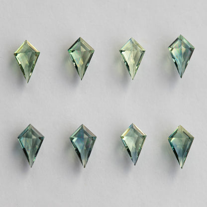 Reverse faces of the kite sapphires arranged in two rows.