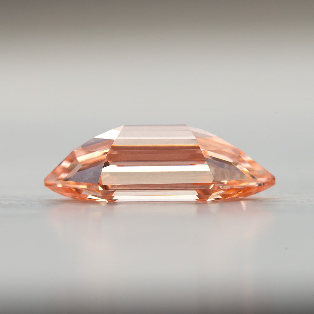 Low side profile of the loose lab-grown diamond showing pavilion depth and pointed ends.